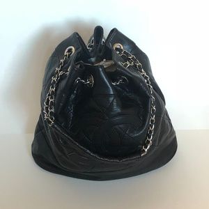 Black bag with a double C logo, chain handle.